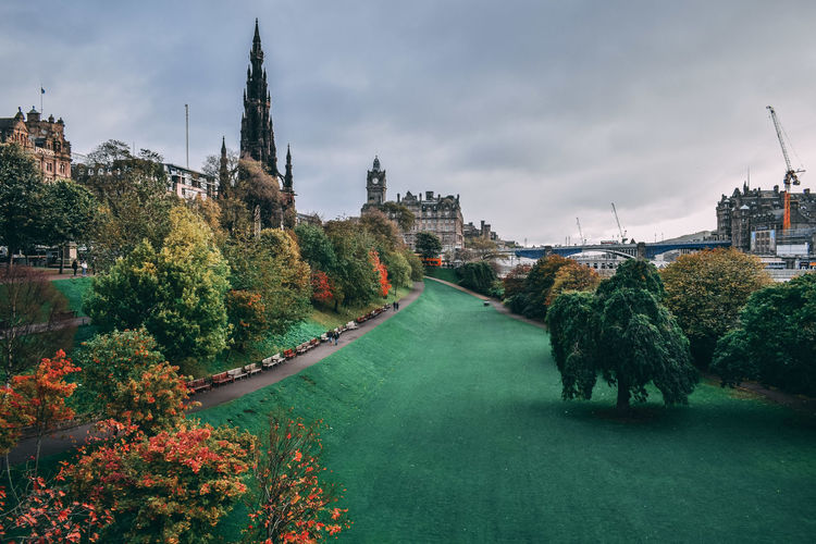 View of princess street garden in autumn with the famous scots monument in the background 