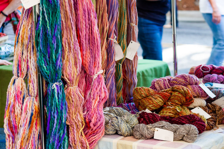 Skeins of multi colored yarn for sale in farmers market