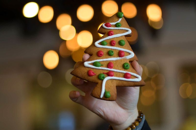Close-up of hand holding gingerbread christmas tree