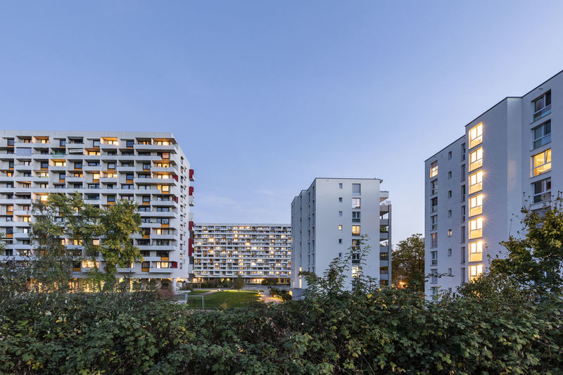 Germany, baden-wurttemberg, stuttgart, apartment buildings in hallschlag district at dusk