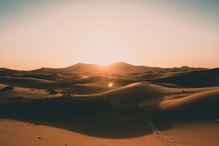 Empty sahara desert dunes in beautiful morning sunrise light with no people