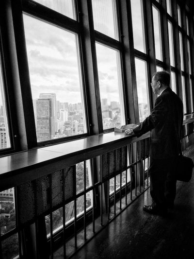 People looking through modern building