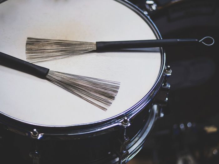 Close-up of broom on drum