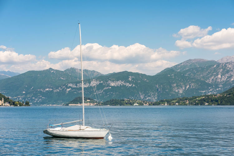 Sailboat in sea against sky