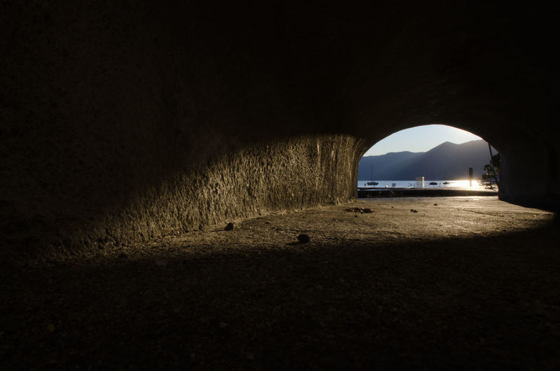 Lake maggiore and mountains seen through tunnel