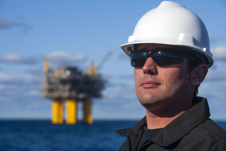 Offshore energy production with person on ship person