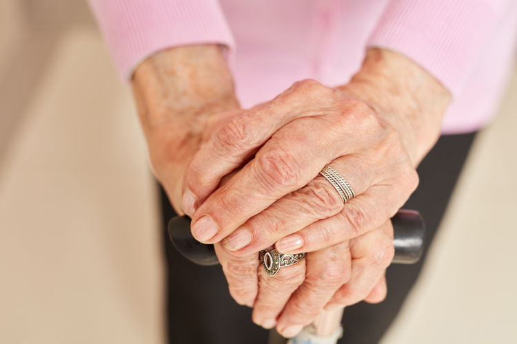 Close-up of woman hand on wall