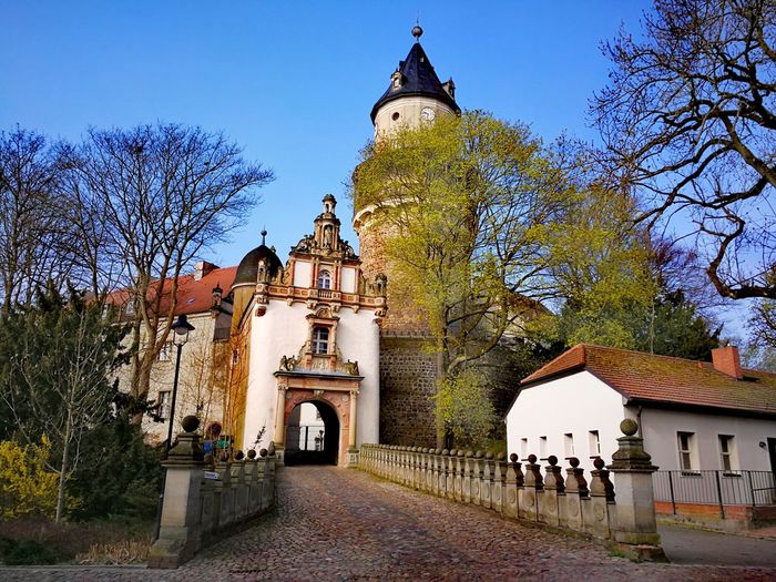 View of church and buildings against sky