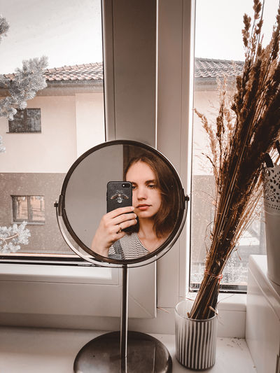 Portrait of young woman using smart phone