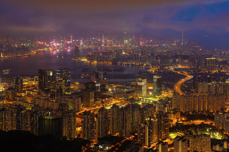 High angle view of illuminated city buildings at night