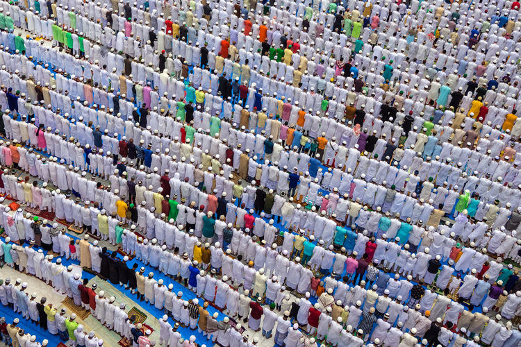 High angle view of islamic men praying outdoors