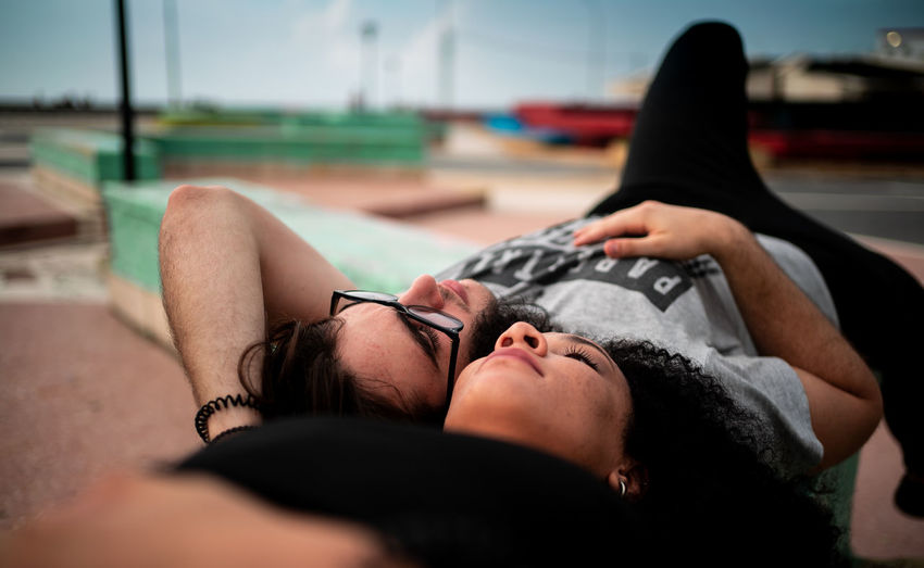 Close-up of couple relaxing outdoors