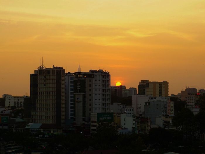 Cityscape against sky during sunset