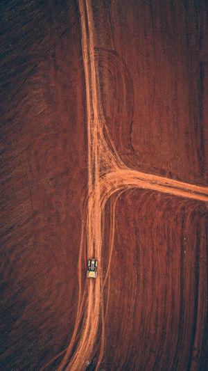 Aerial view of road by land