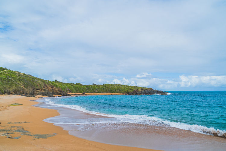 Scenic view of beach against sky