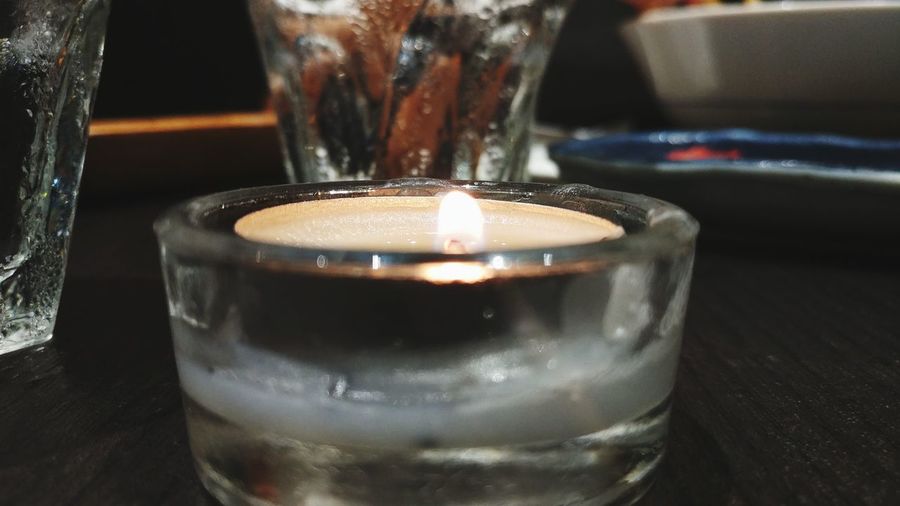 Close-up of tea light candle on table