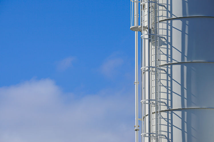 Low angle view of building against clear blue sky