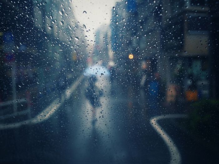 Close-up of wet window in rainy season