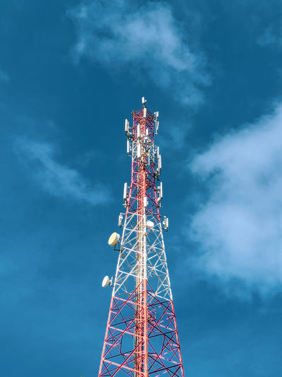 Low angle view of signal tower against sky