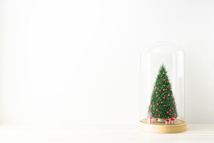 Christmas decoration on table against white background