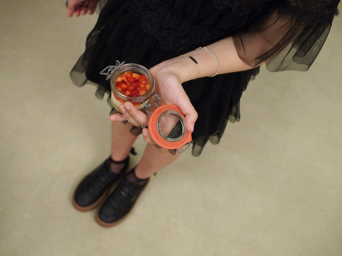 Low section of woman holding ice cream