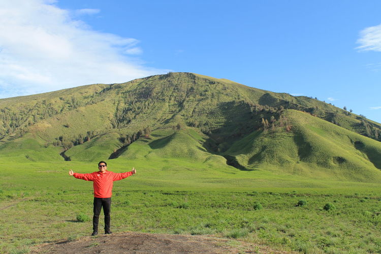 View of man standing in front of mount bromo