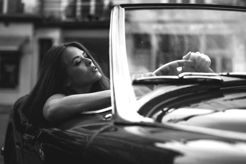 Young woman driving convertible