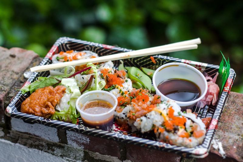 High angle view of sushi in container on wall