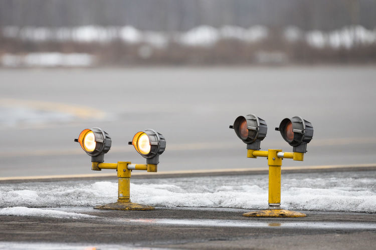 Airport runway guarding lights, traffic safety lights in winter time.