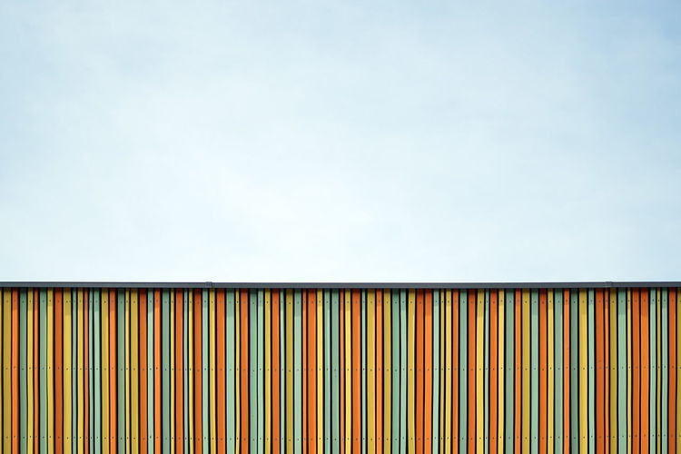 Low angle view of colorful building against sky