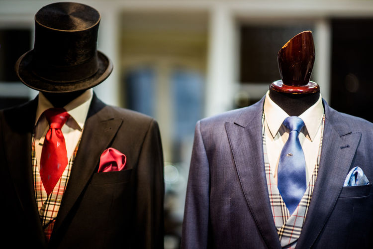 Close-up of suits in display at store