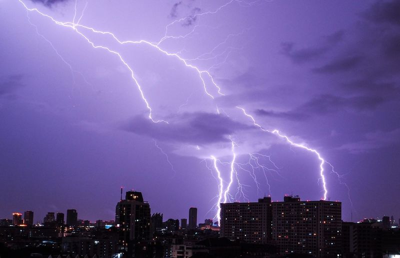 Lightning in sky over city