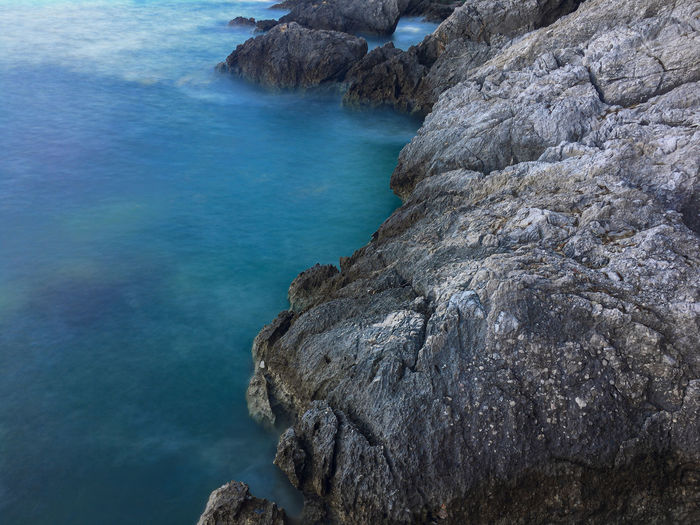 High angle view of rock formation in sea