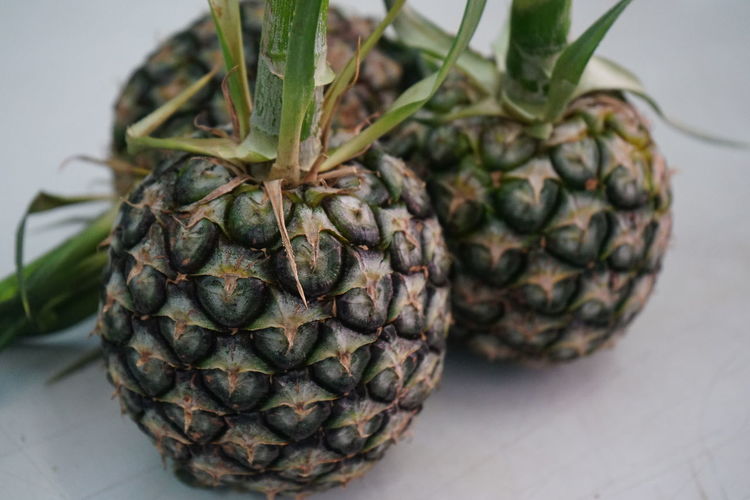 Full frame shot of pineapple on white background