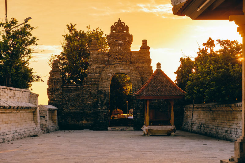 Exterior of temple against sky during sunset
