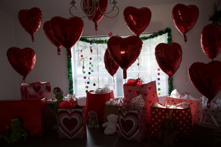 Heart shape lanterns hanging on table