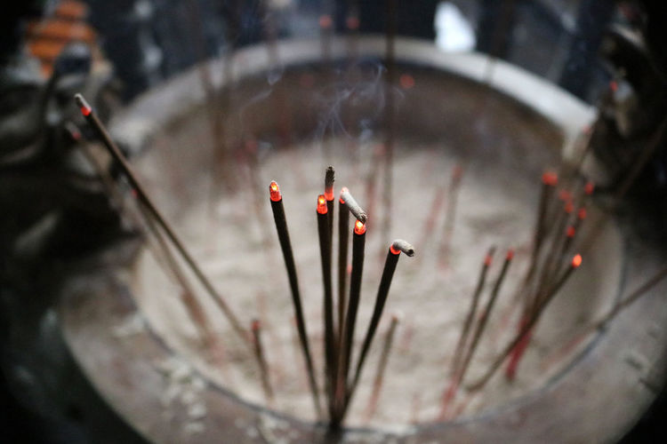 Close-up view of incense burning