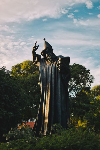 Low angle view of statue against sky