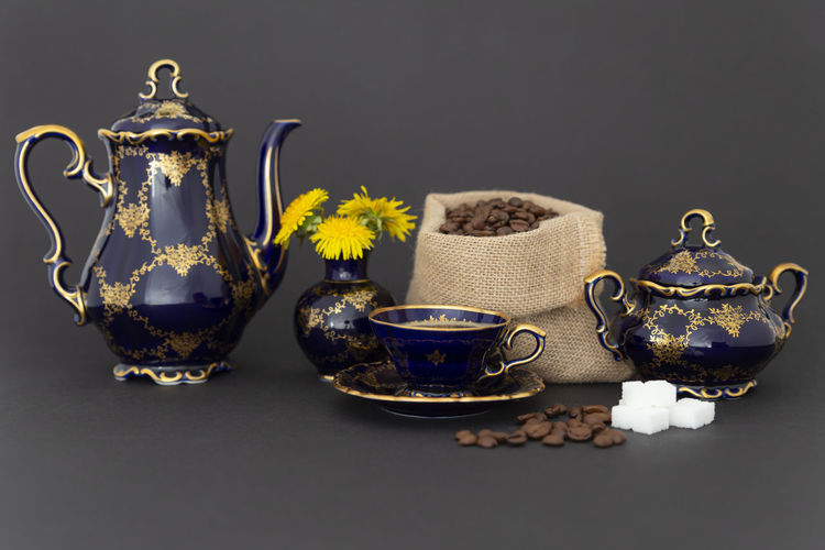Close-up of tea on table against black background
