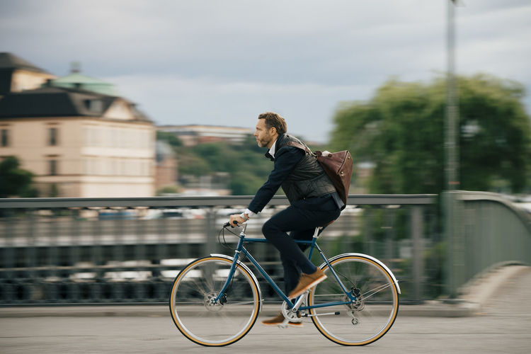 Man riding bicycle in city