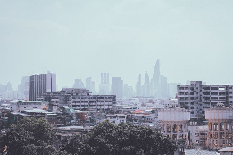 Downtown bangkok city hidden in a veil of smog in the early morning