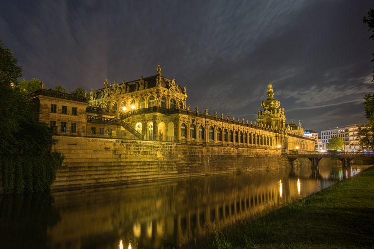 Reflection of illuminated the zwinger on river at night