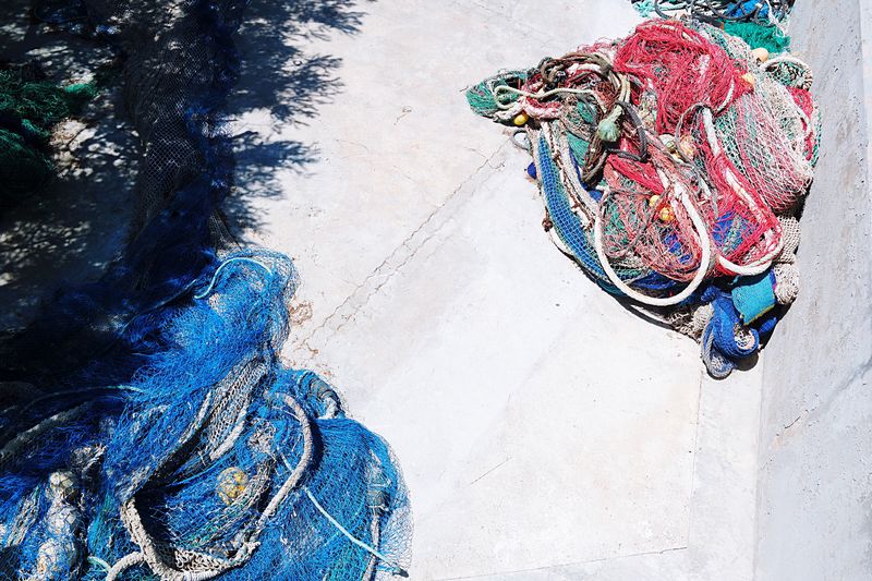 High angle view of fishing nets on sunny day