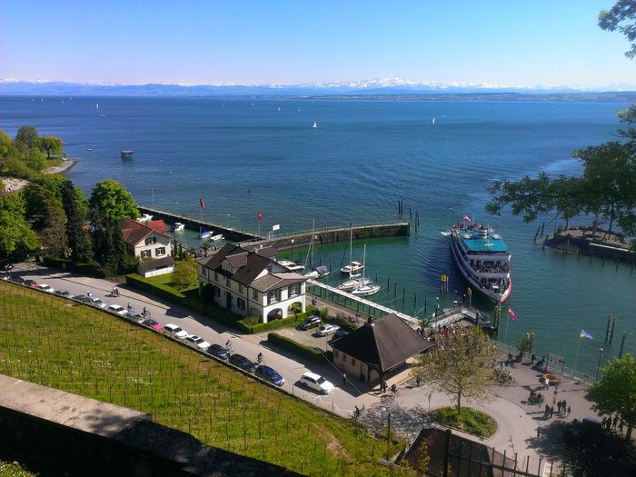 High angle view of buildings by harbor at meersburg