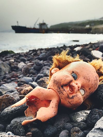 Close-up of toy on beach