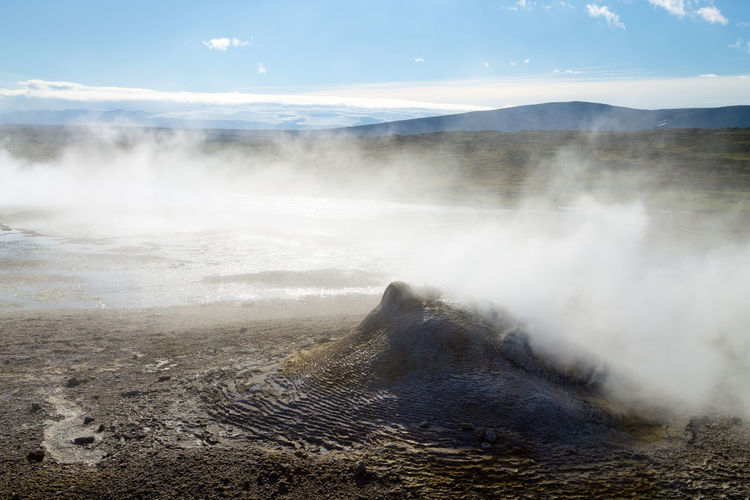 Scenic view of volcanic landscape against sky