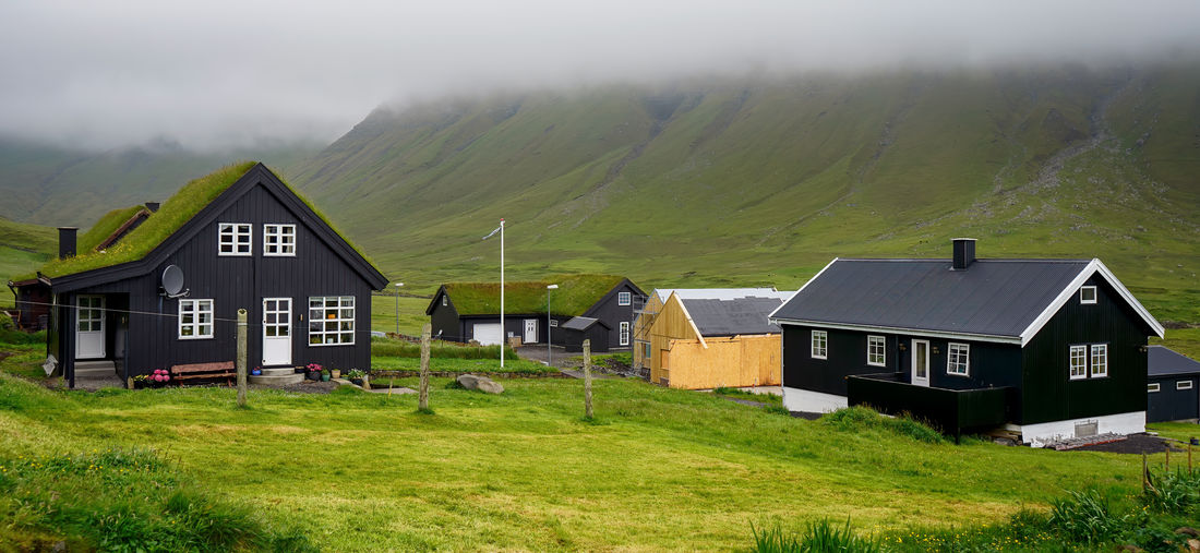 Typical small village in faroe islands. tradicional faroese grass-covered houses 