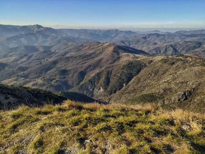 Ligurian appennino to the alps. at horizon the alpine snowcapped arch from monviso to rosa.