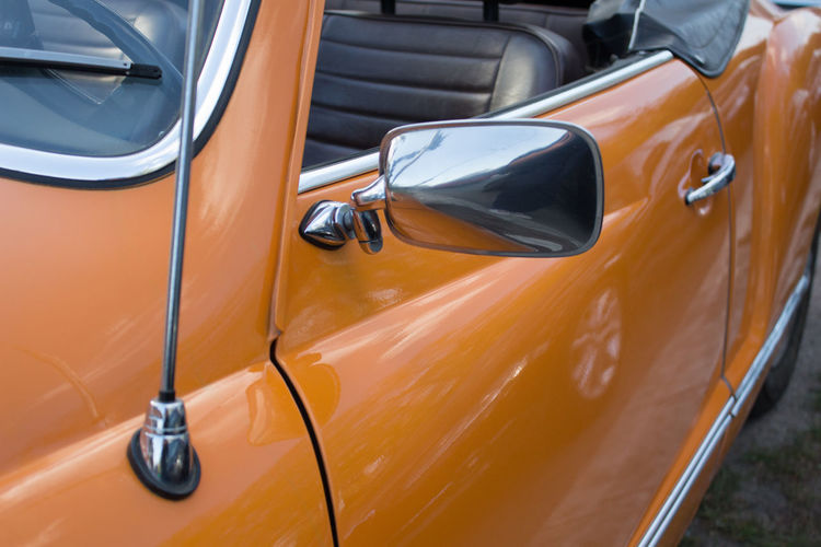 Close-up of side-view mirror in car