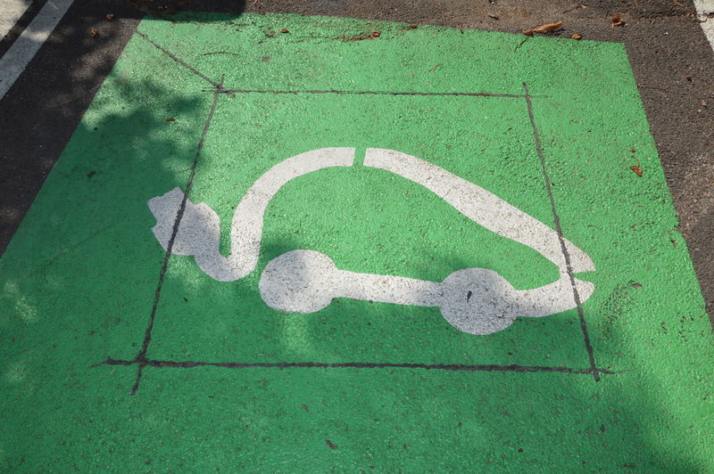 Electrical vehicle charging station sign on the ground in france